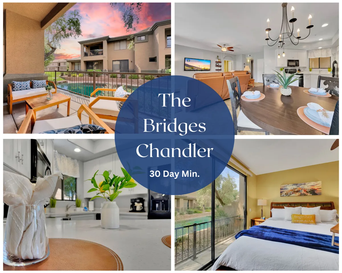 The image showcases an inviting open-concept living space with a modern kitchen, a stylish dining area set for a meal, and large windows revealing a tranquil outdoor seating area overlooking the water. The cozy bedroom is visible in the background, and soft lighting creates a warm, welcoming atmosphere.